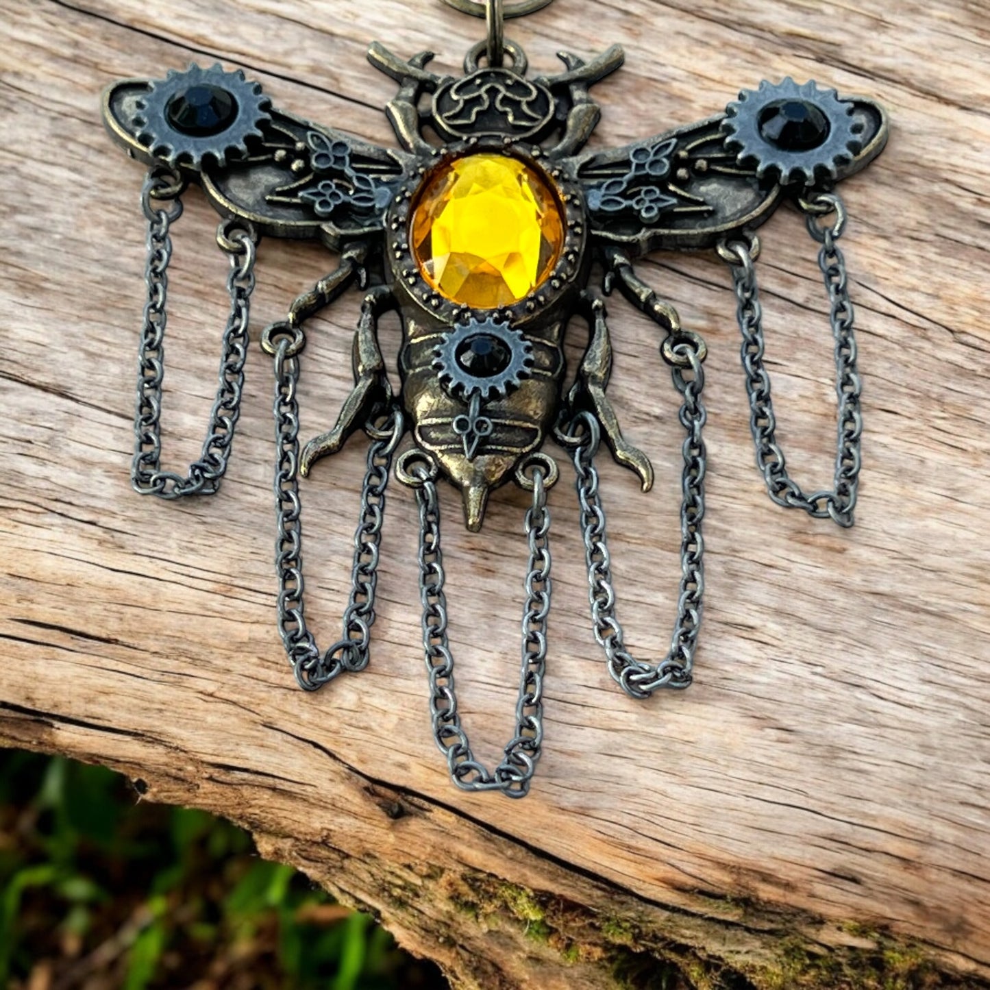 Fantasy bee purse accessory with glowing crystal and bronze finish