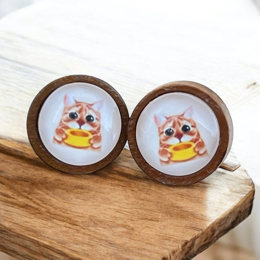 Funny cat earrings with hungry orange cat holding yellow bowl