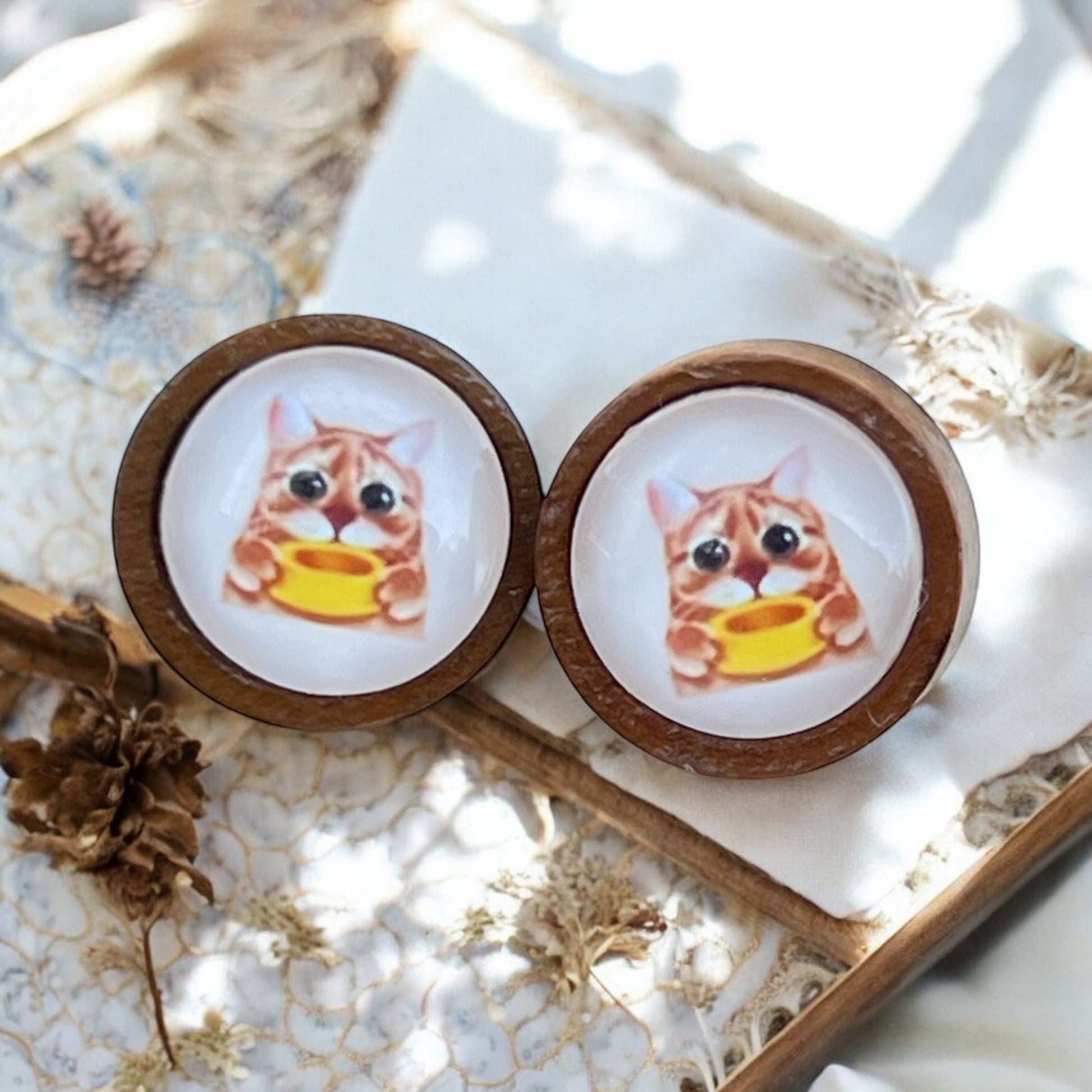 Giftable cat earrings shown with card and packaging