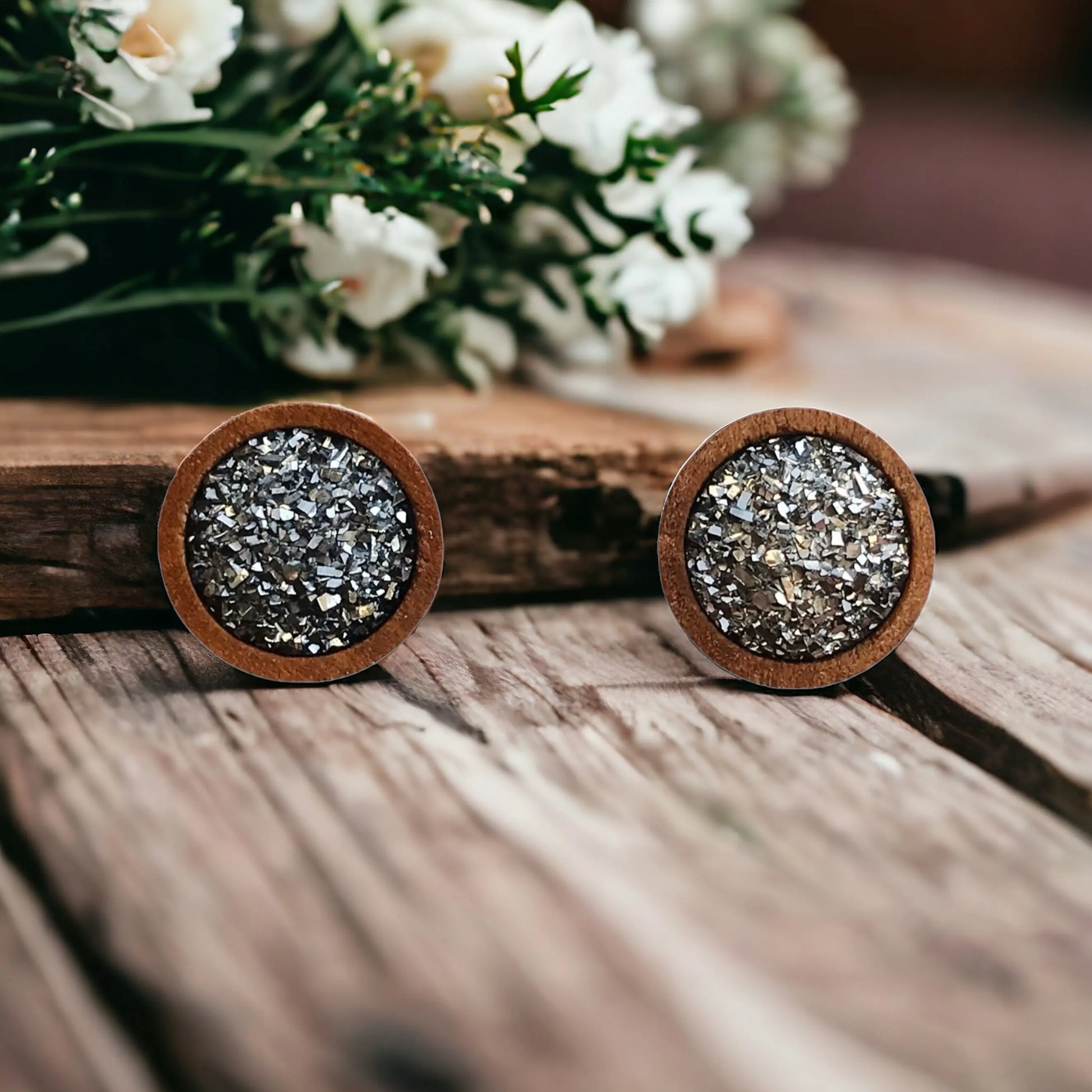 Round slate gray druzy wood stud earrings displayed on a rustic wood surface