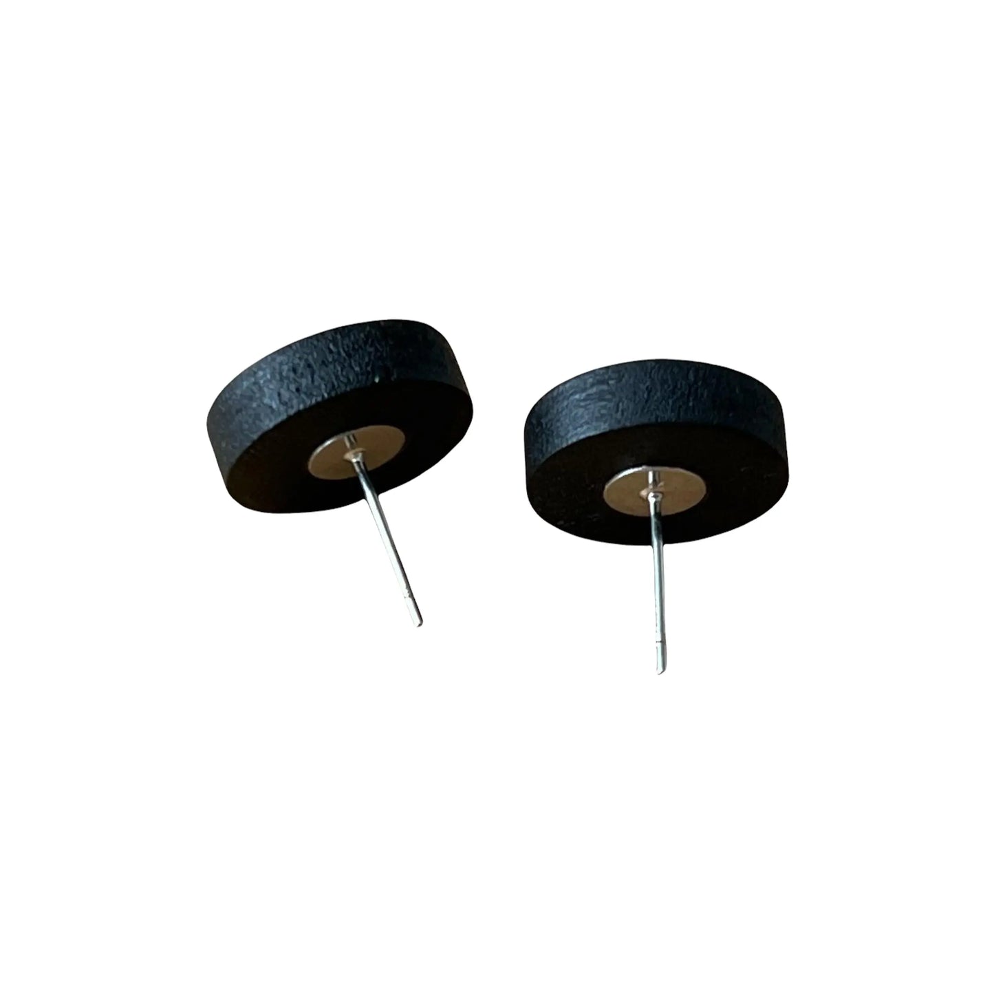 Back of round gray resin stud earrings with black wood border displayed on white background 