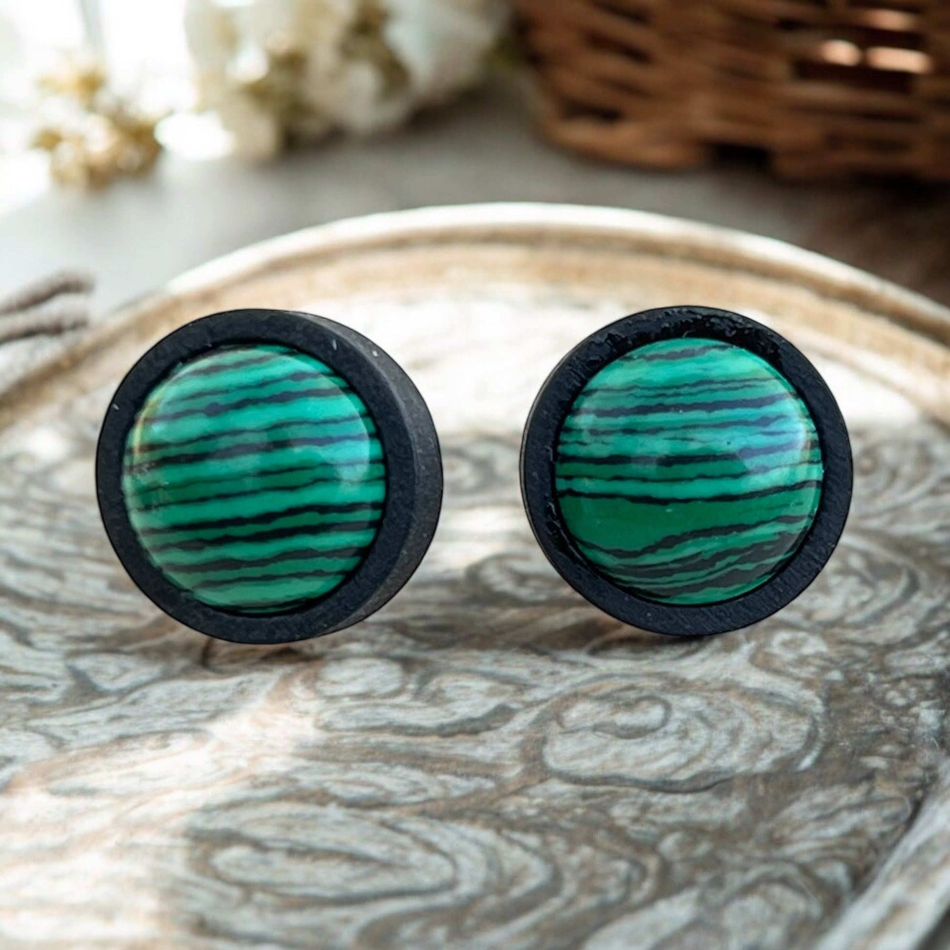 Nature-inspired green stone earrings styled with neutral tones
