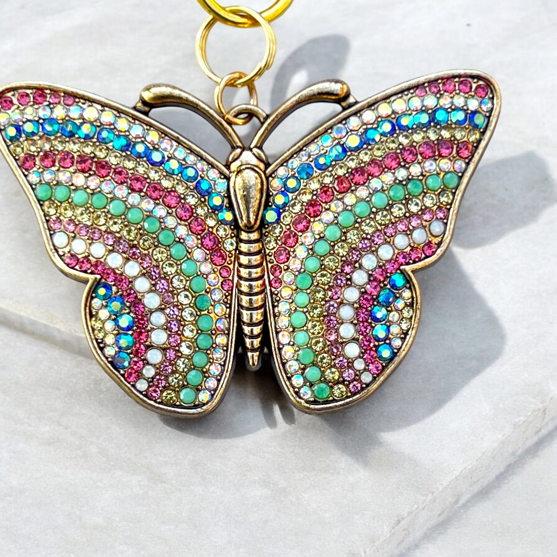 Handmade butterfly accessory with gold-toned clasp and acrylic wings