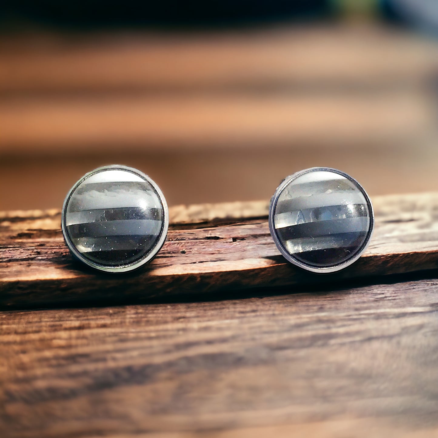 Black and white resin earrings photographed with soft lighting