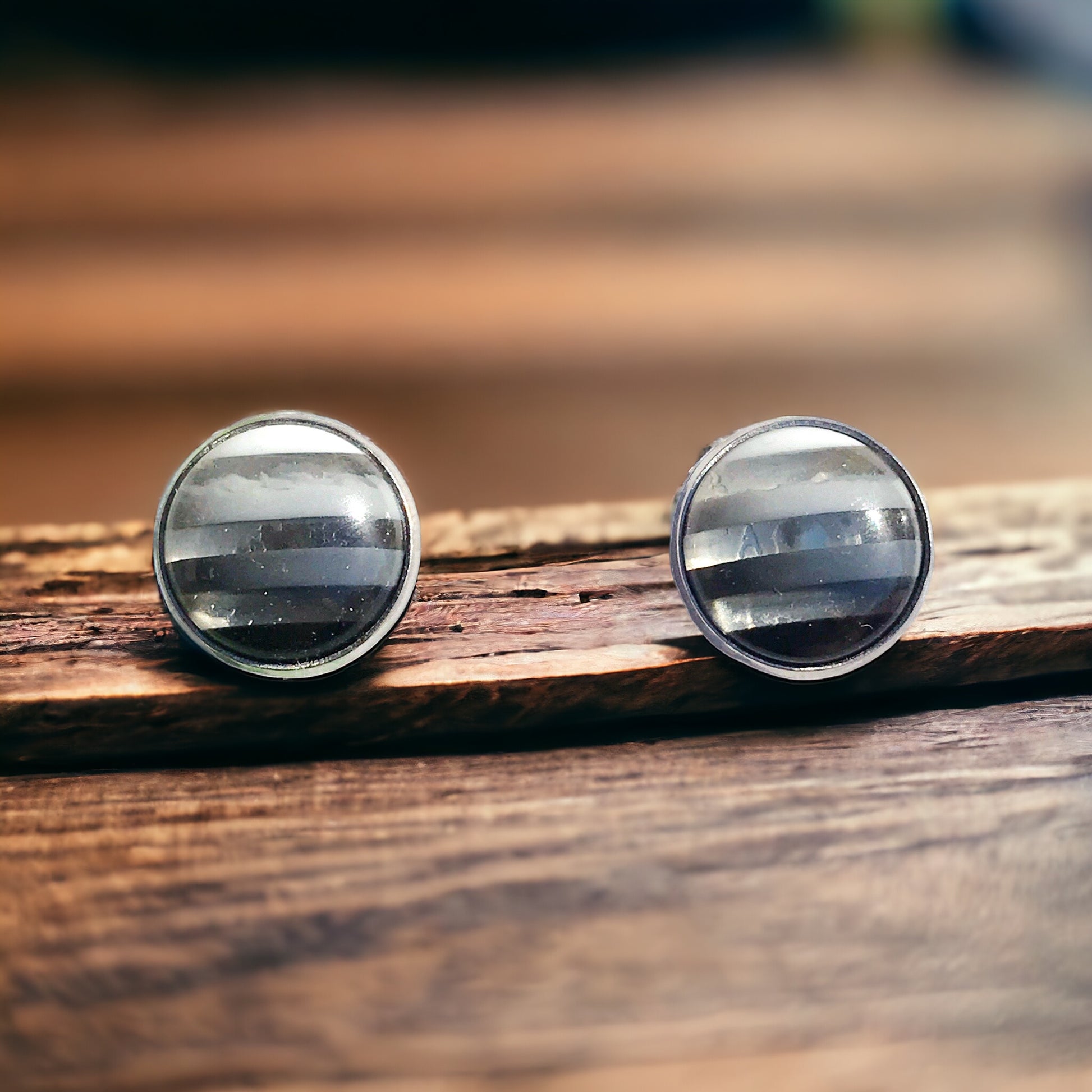 Black and white resin earrings photographed with soft lighting