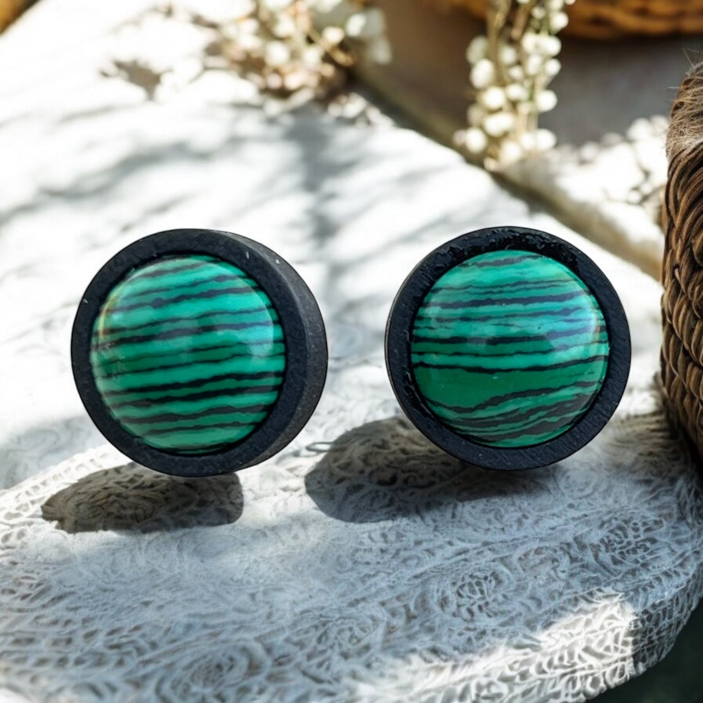Side view of handmade wood earrings with stainless steel posts