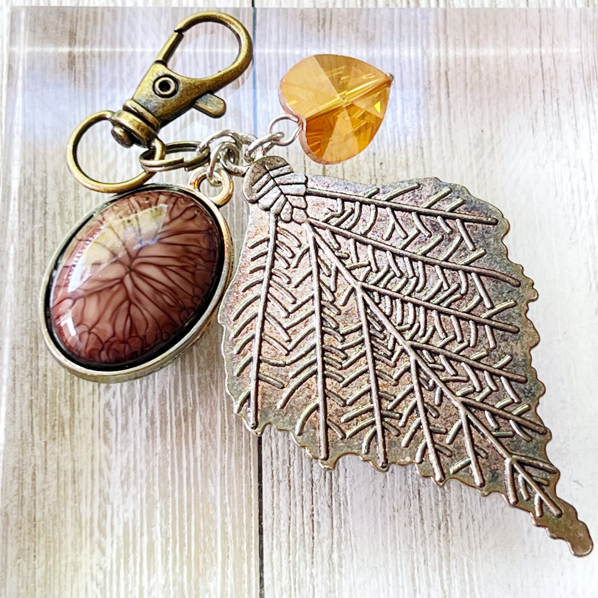 Leaf Purse Charm – Bronze Botanical Keychain with Glass Heart Accent
