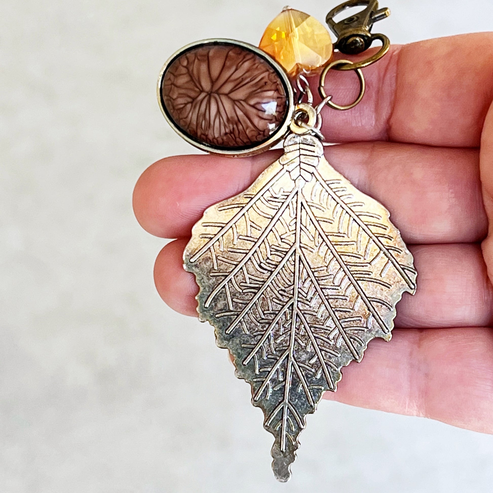 Leaf Purse Charm – Bronze Botanical Keychain with Glass Heart Accent
