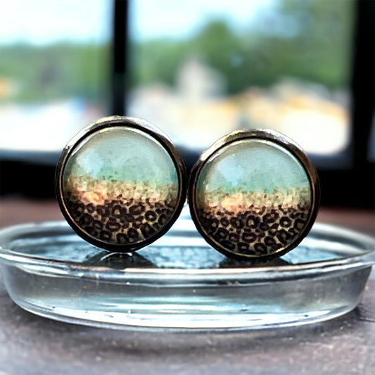 Round mint ombre stud earrings with leopard print detail in a dark metal setting