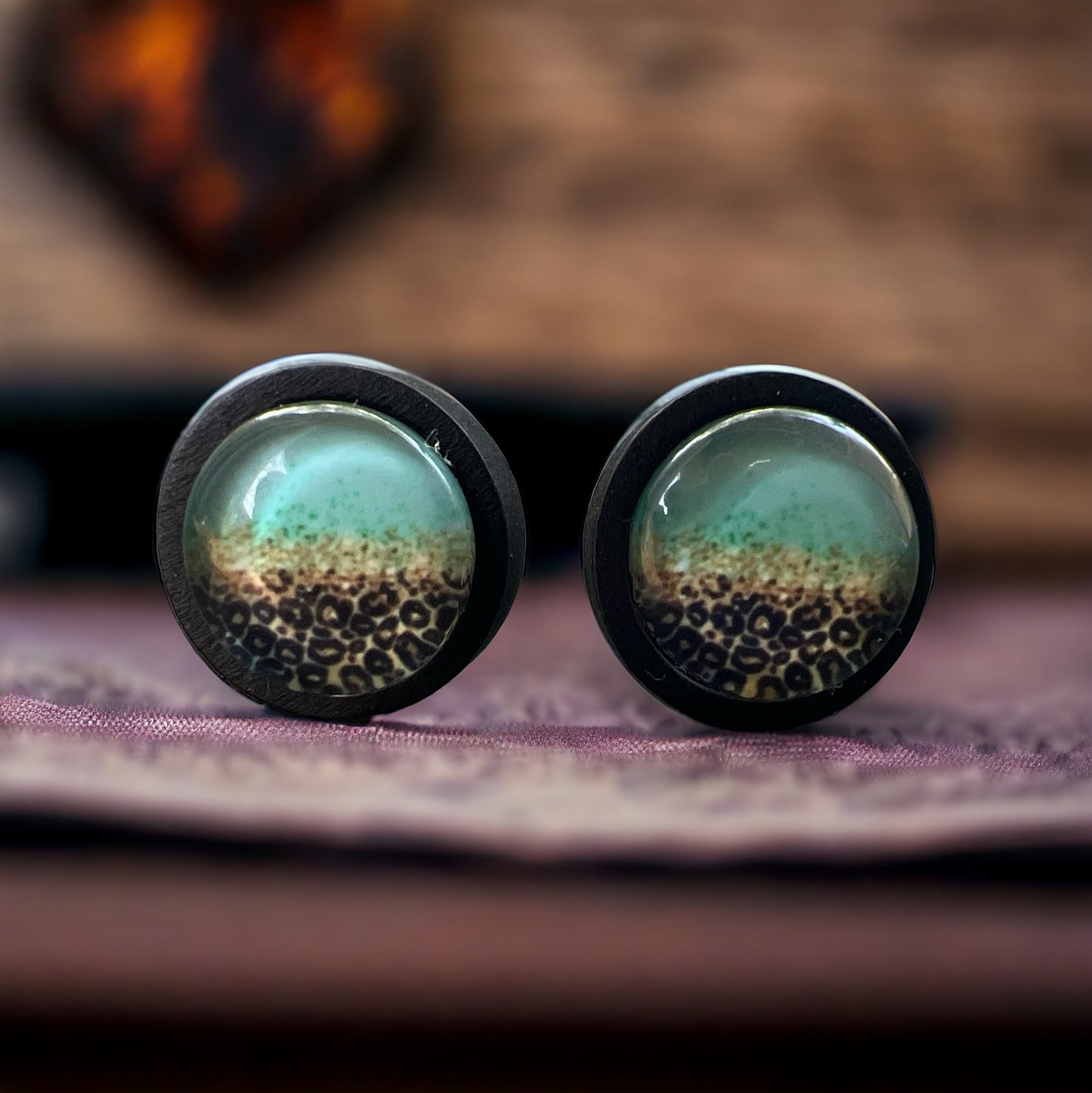 Turquoise Leopard Fade Resin Stud Earrings – Bold Handmade Boho Jewelry Close up blurred background