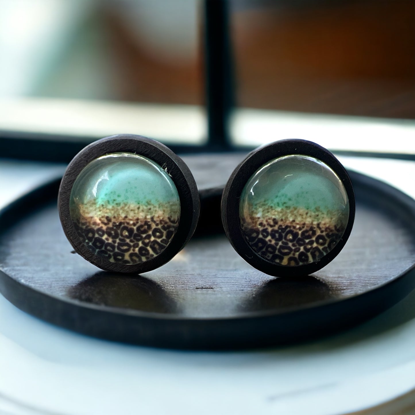 Mint Leopard Fade Resin Stud Earrings – Bold Handmade Boho Jewelry on black wooden tray