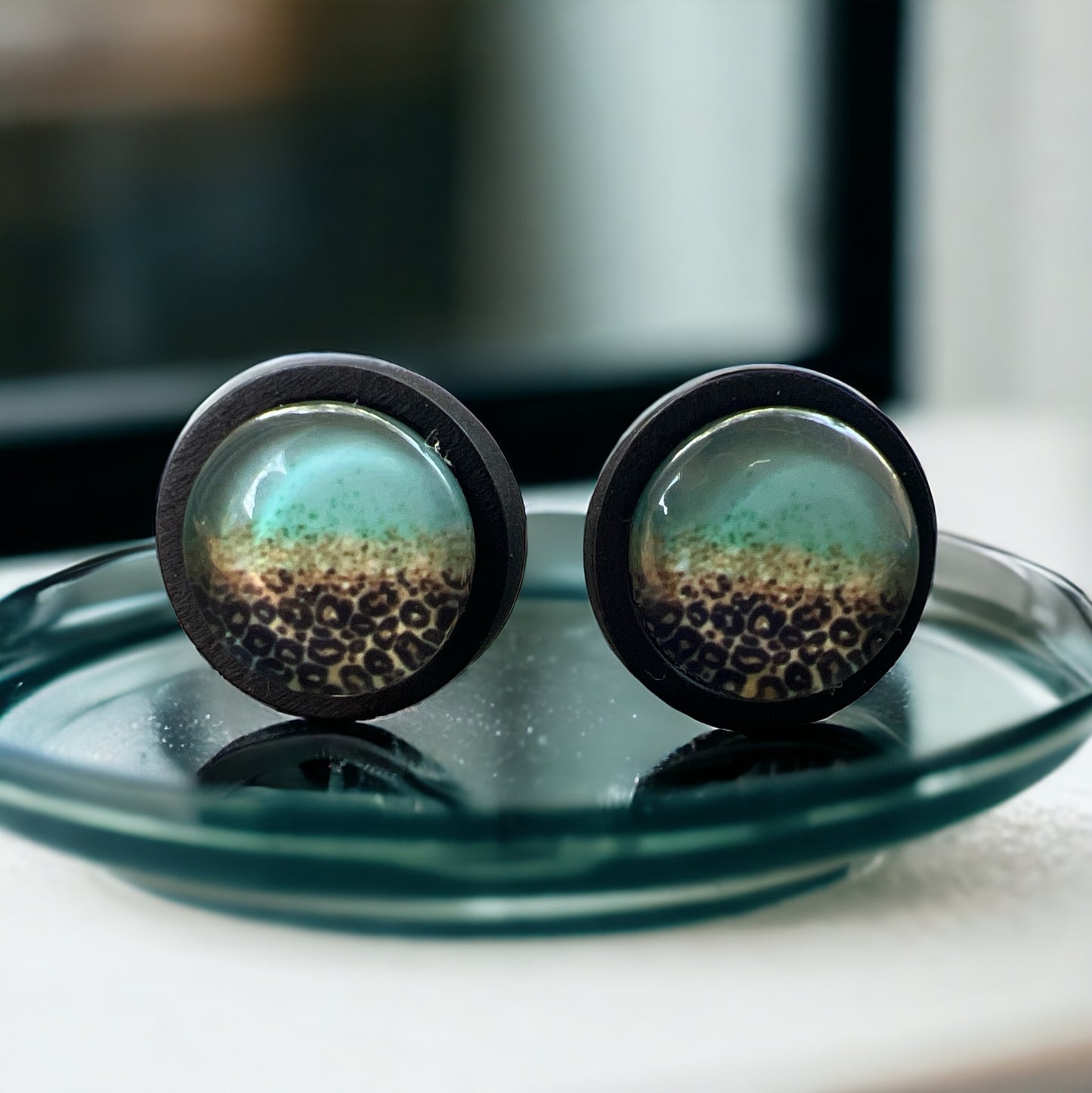 Leopard Fade Resin Stud Earrings – Bold Mint Handmade Jewelry on glass tray