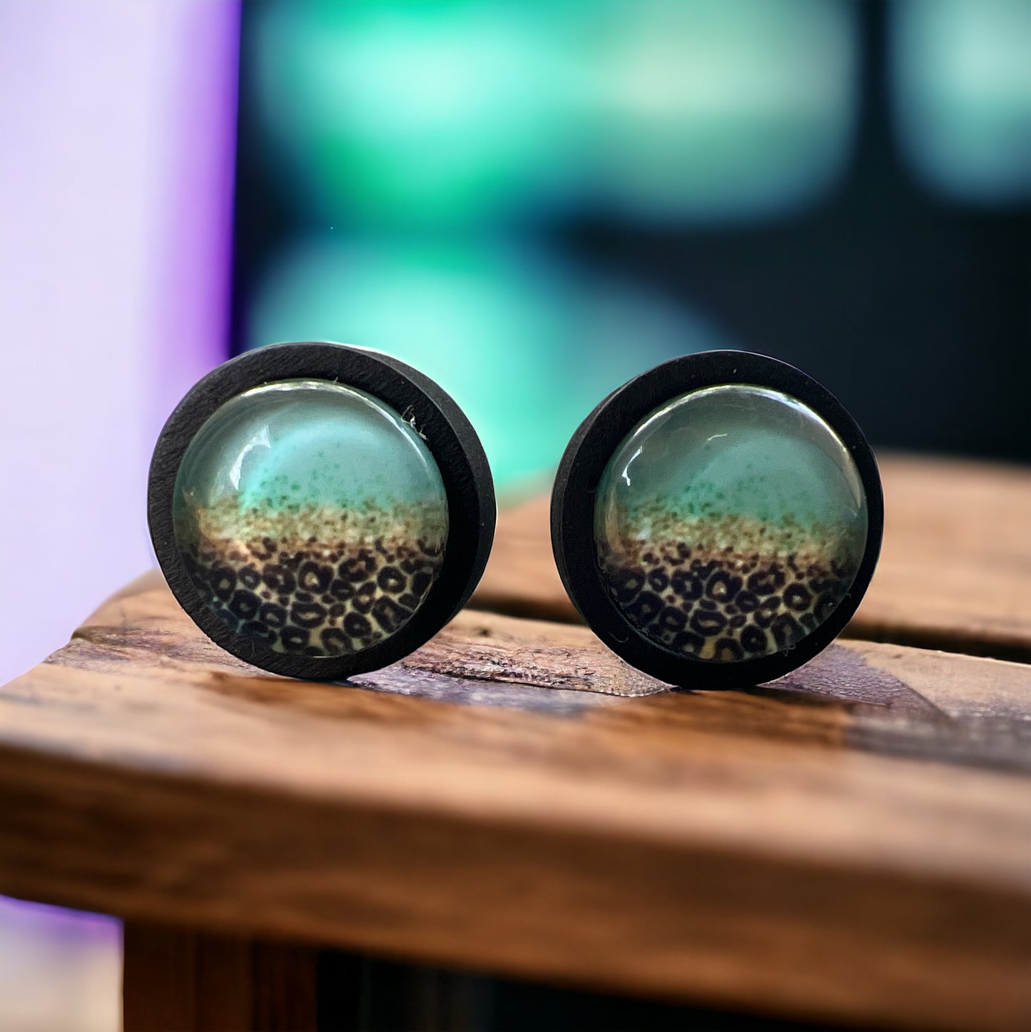 Leopard Mint Fade Resin Stud Earrings – Bold Jewelry on wood slat