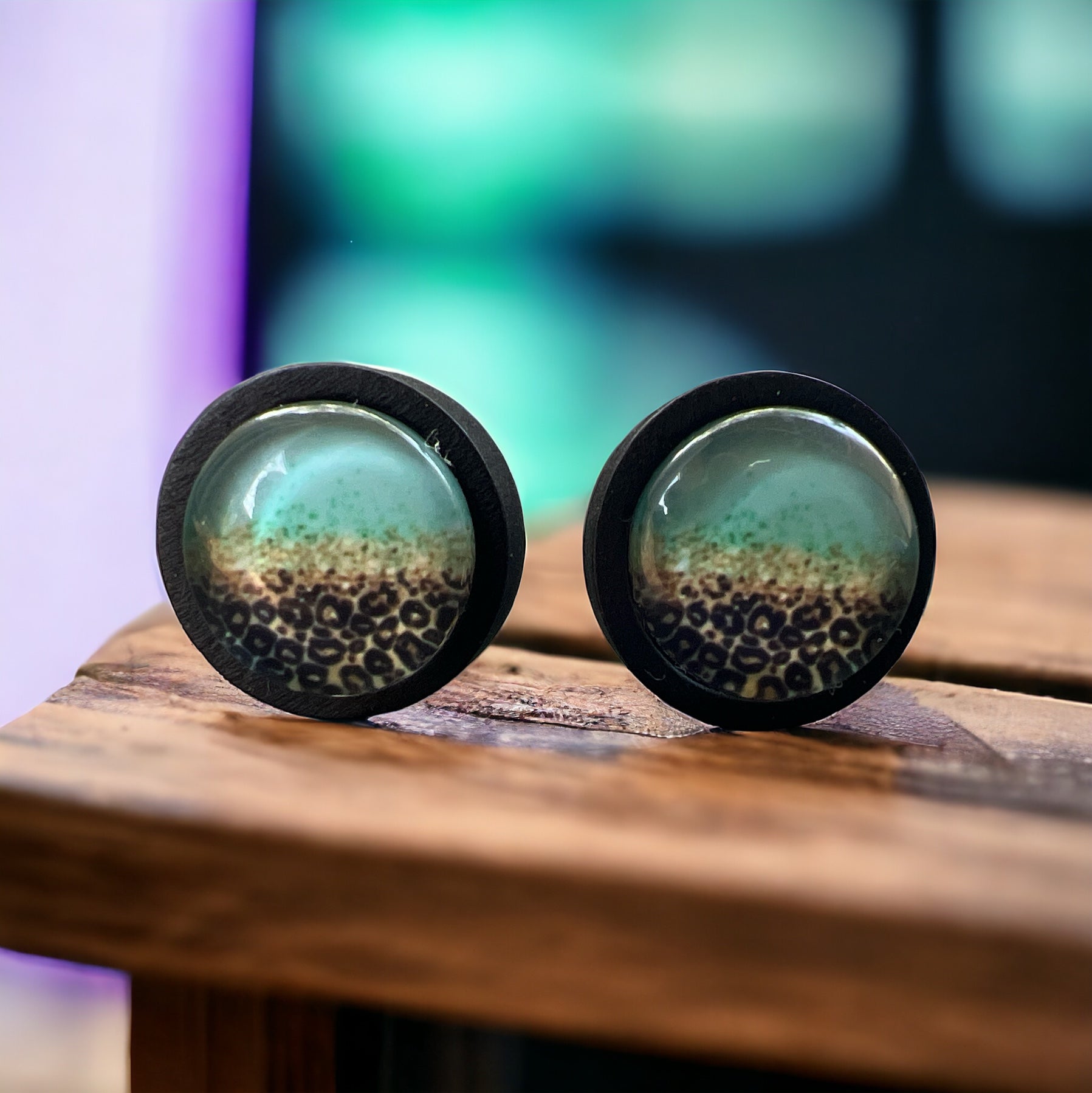 Leopard Mint Fade Resin Stud Earrings – Bold Jewelry on wood slat