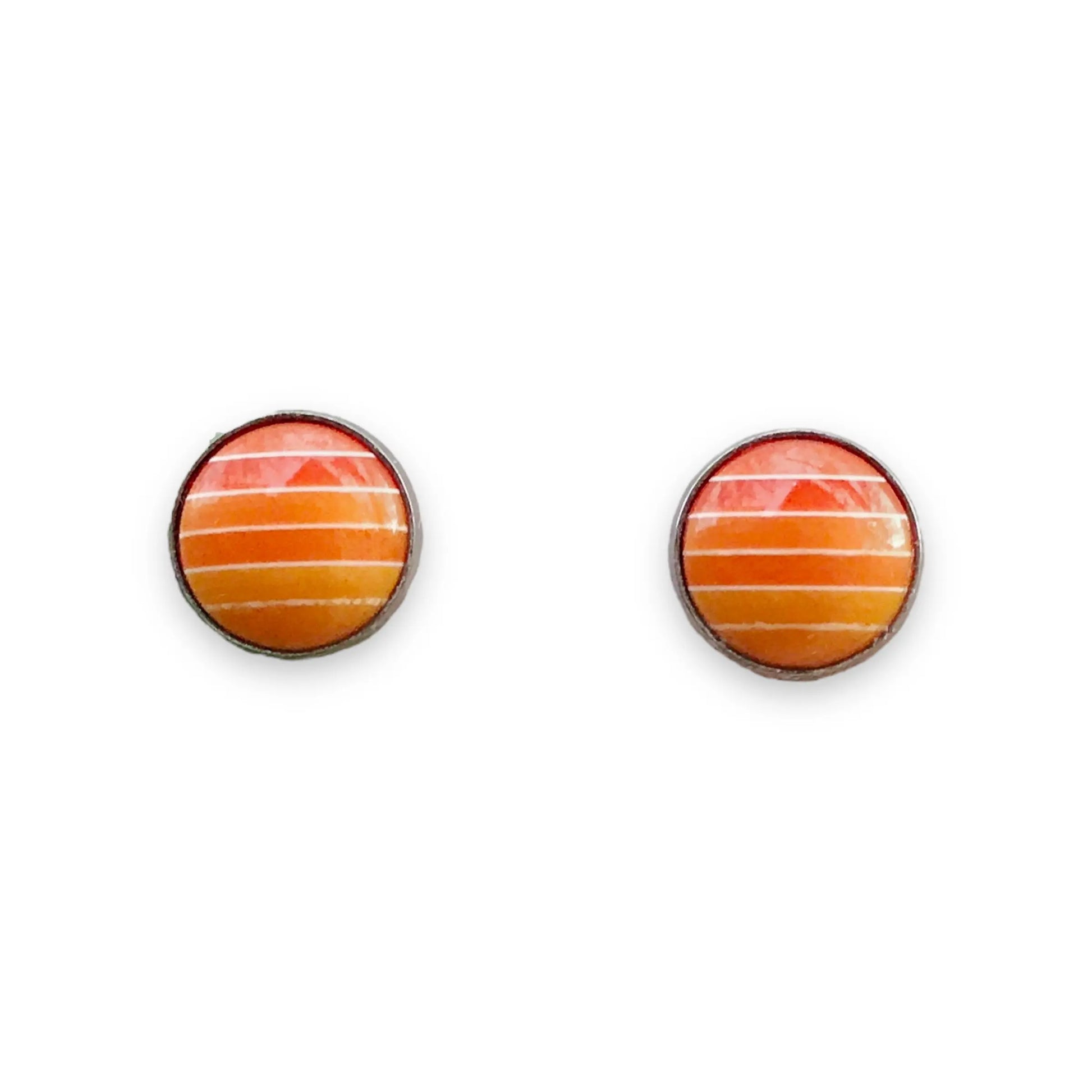 Round orange gradient striped stud earrings in a silver-tone setting displayed on a white background 
