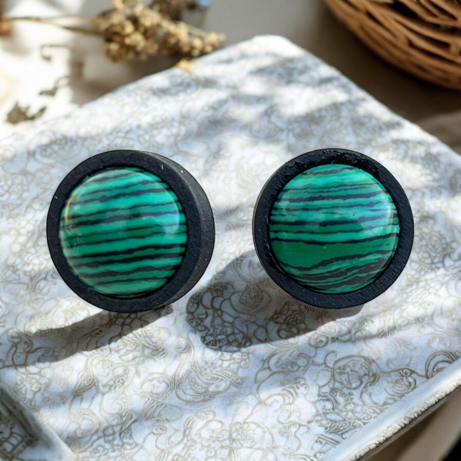 Rustic handmade stud earrings with minimalist background
