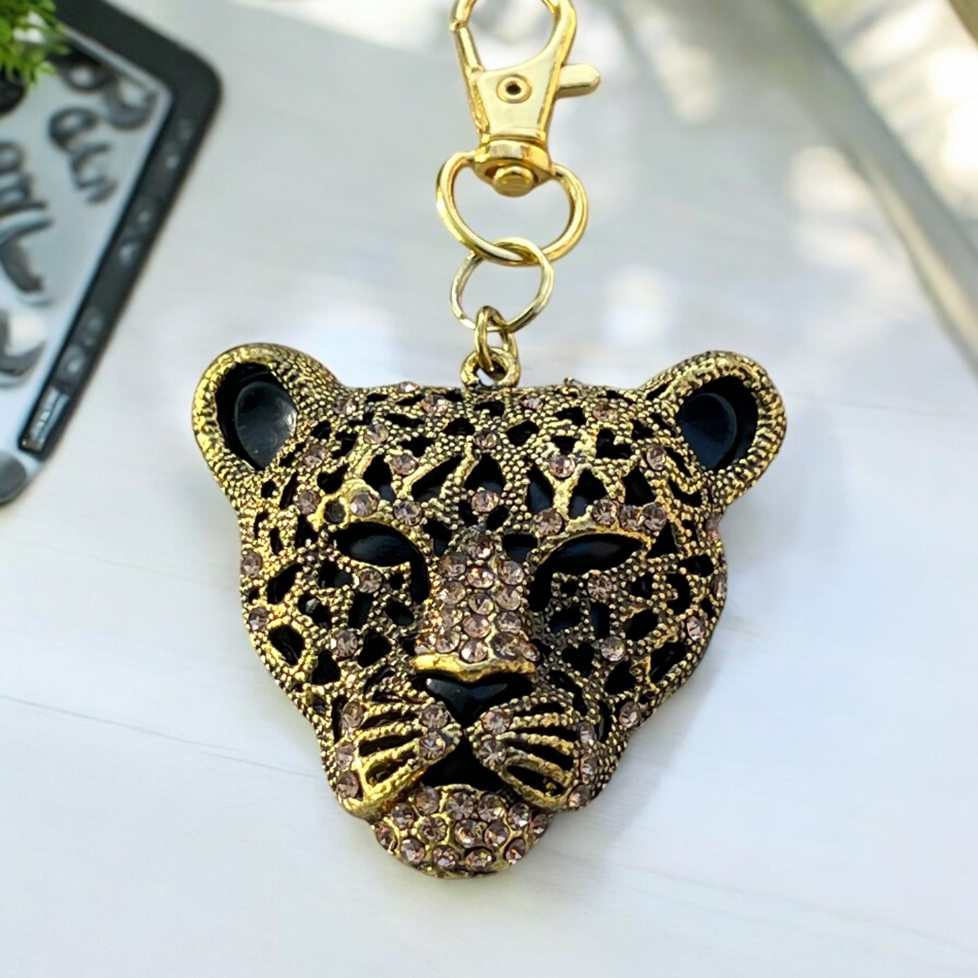 Side view of rhinestone animal print bag charm