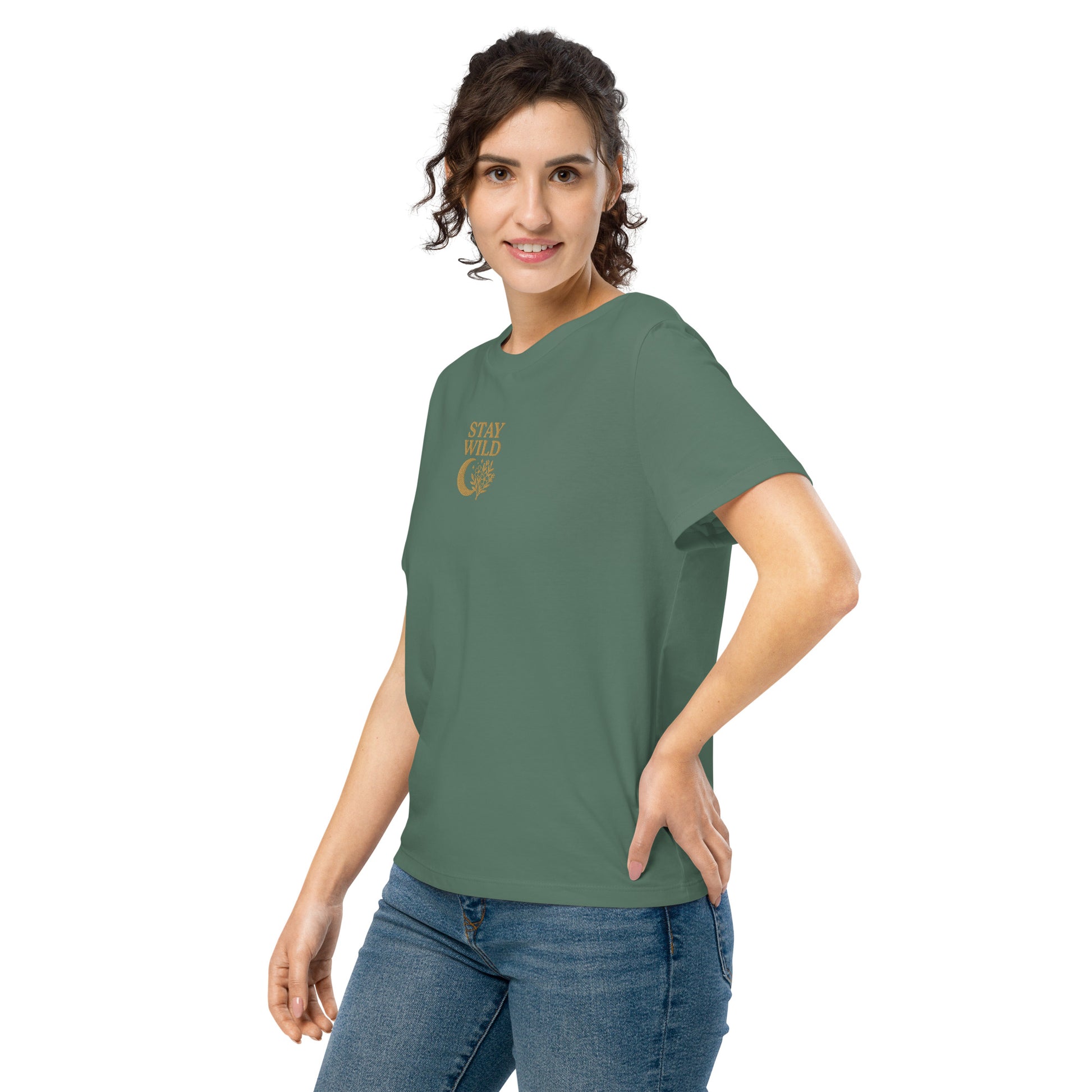 Close-up of floral moon embroidery on green Stay Wild quote shirt