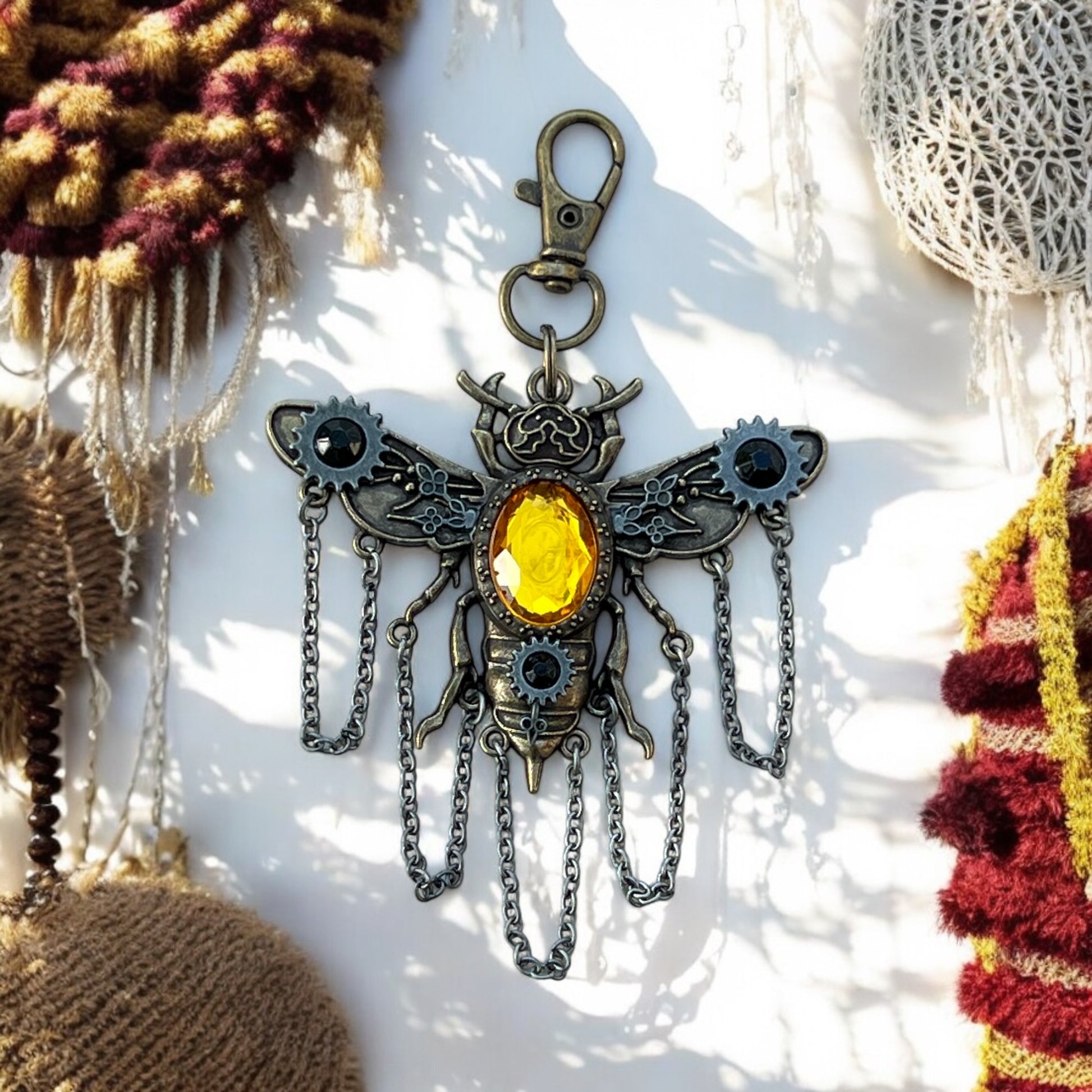 Back view of bee keychain with antique bronze and sturdy clasp