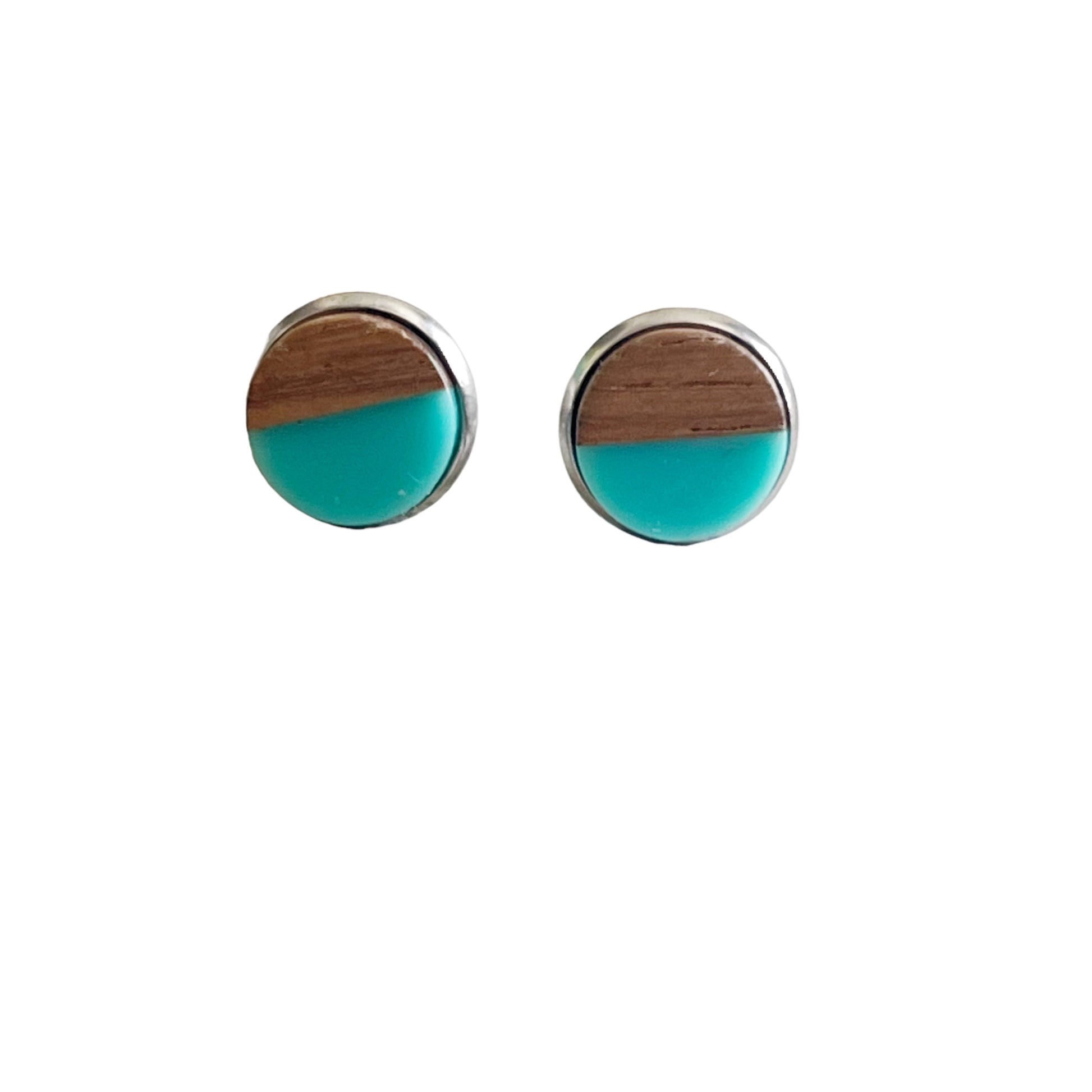 Round teal and wood stud earrings with a glossy resin top displayed on a white background 