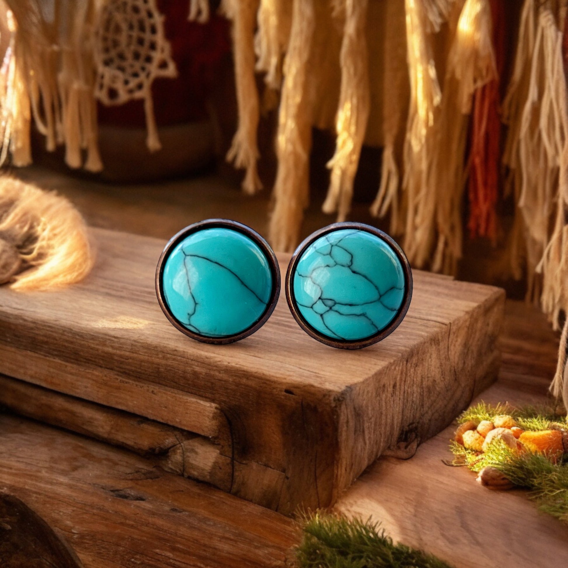 Round turquoise copper stud earrings displayed on a boho wood background