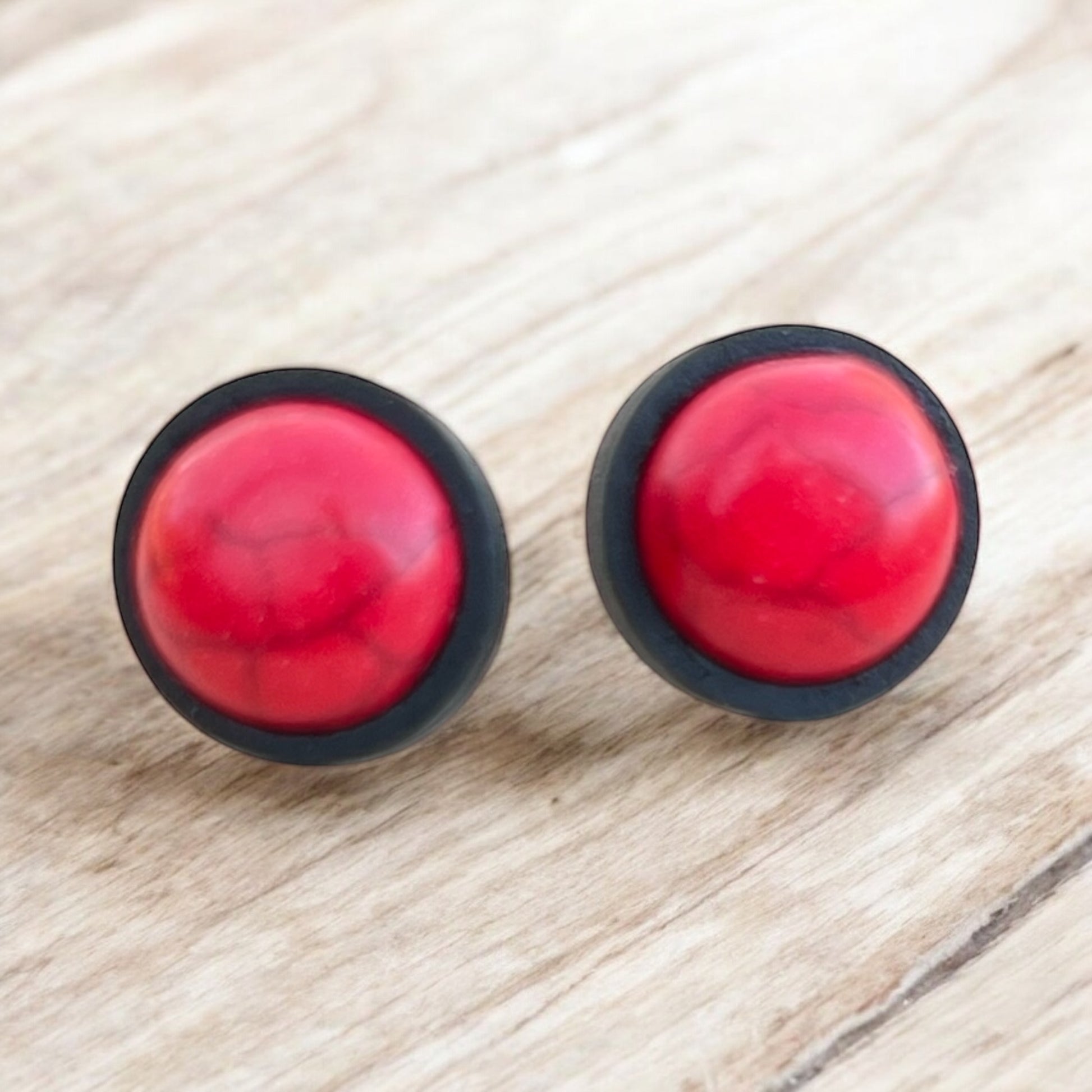 Unisex red wood stud earrings displayed with gift packaging