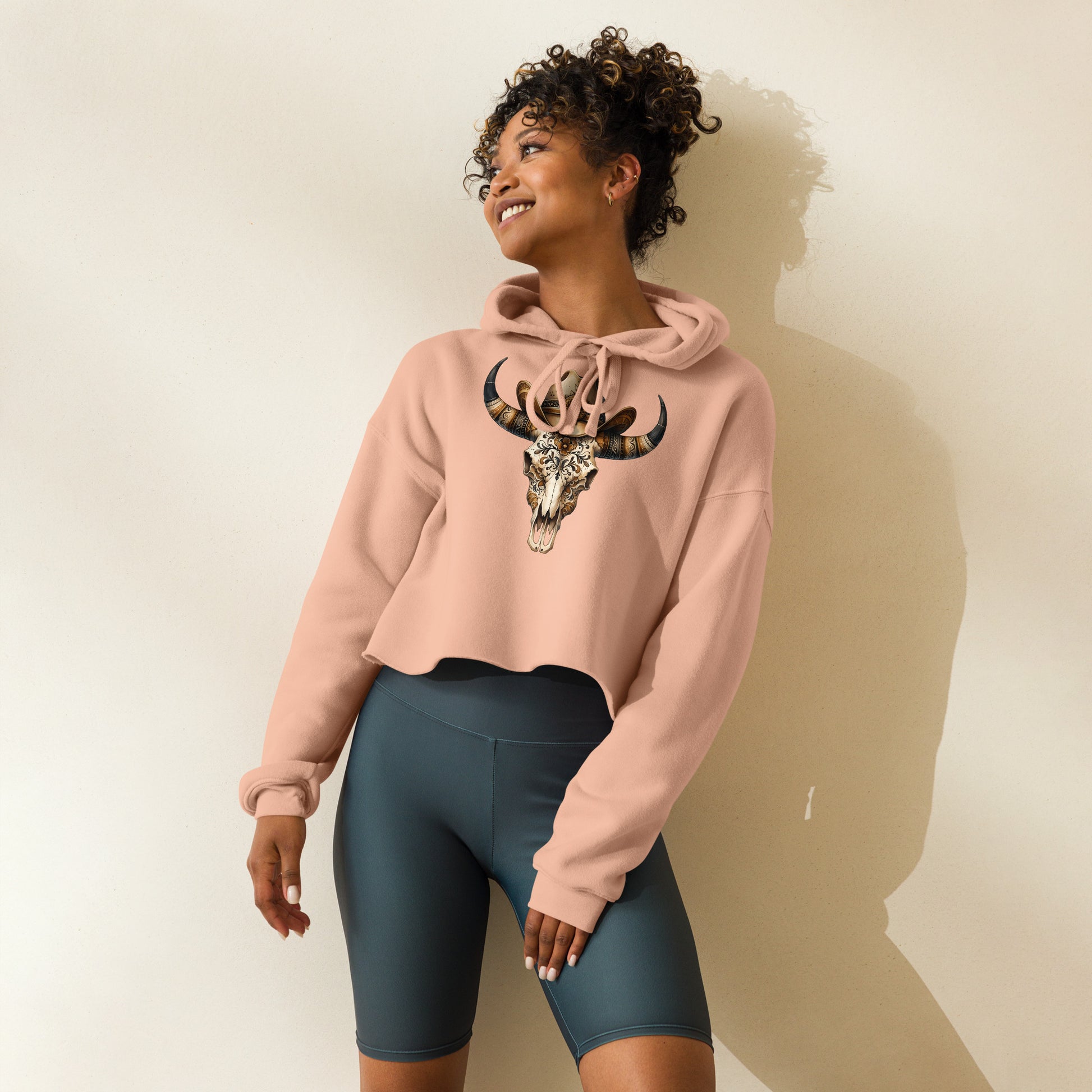 Side view of peach western skull hoodie with baroque floral detailing