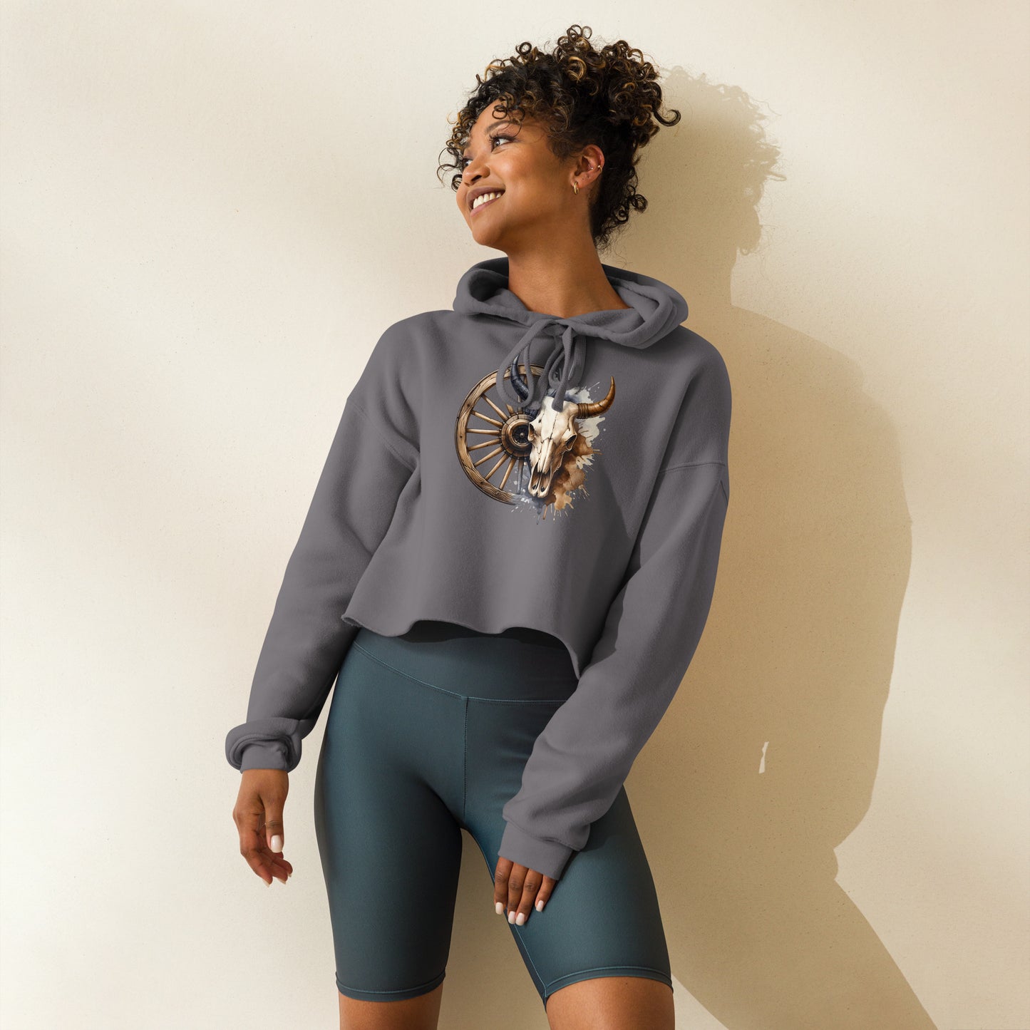 Side view of storm gray hoodie with rustic skull and paint splatter design