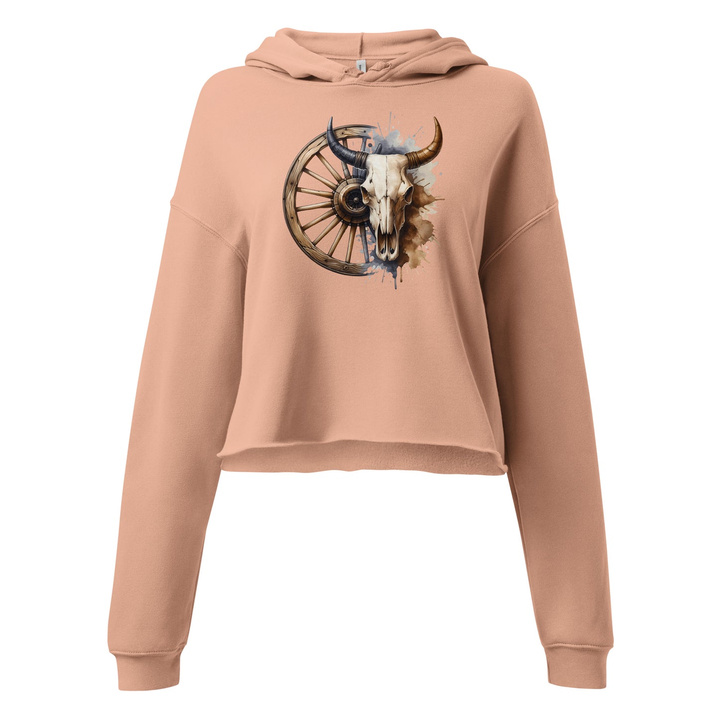 Close-up of bull skull and wagon wheel graphic on peach hoodie with splatter accents