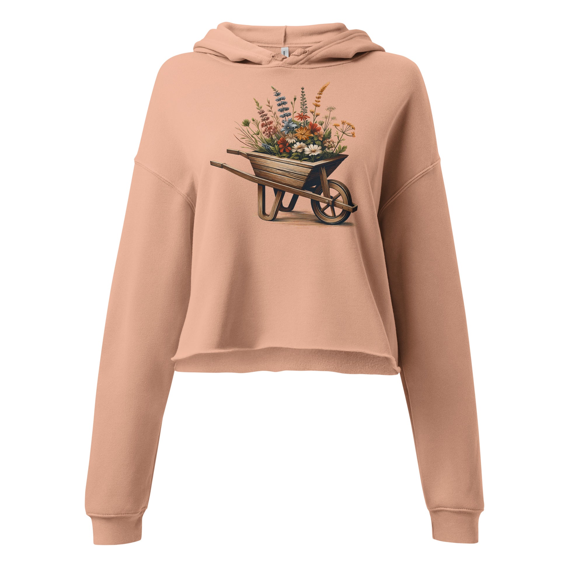 Close-up of floral wheelbarrow graphic on peach hoodie background