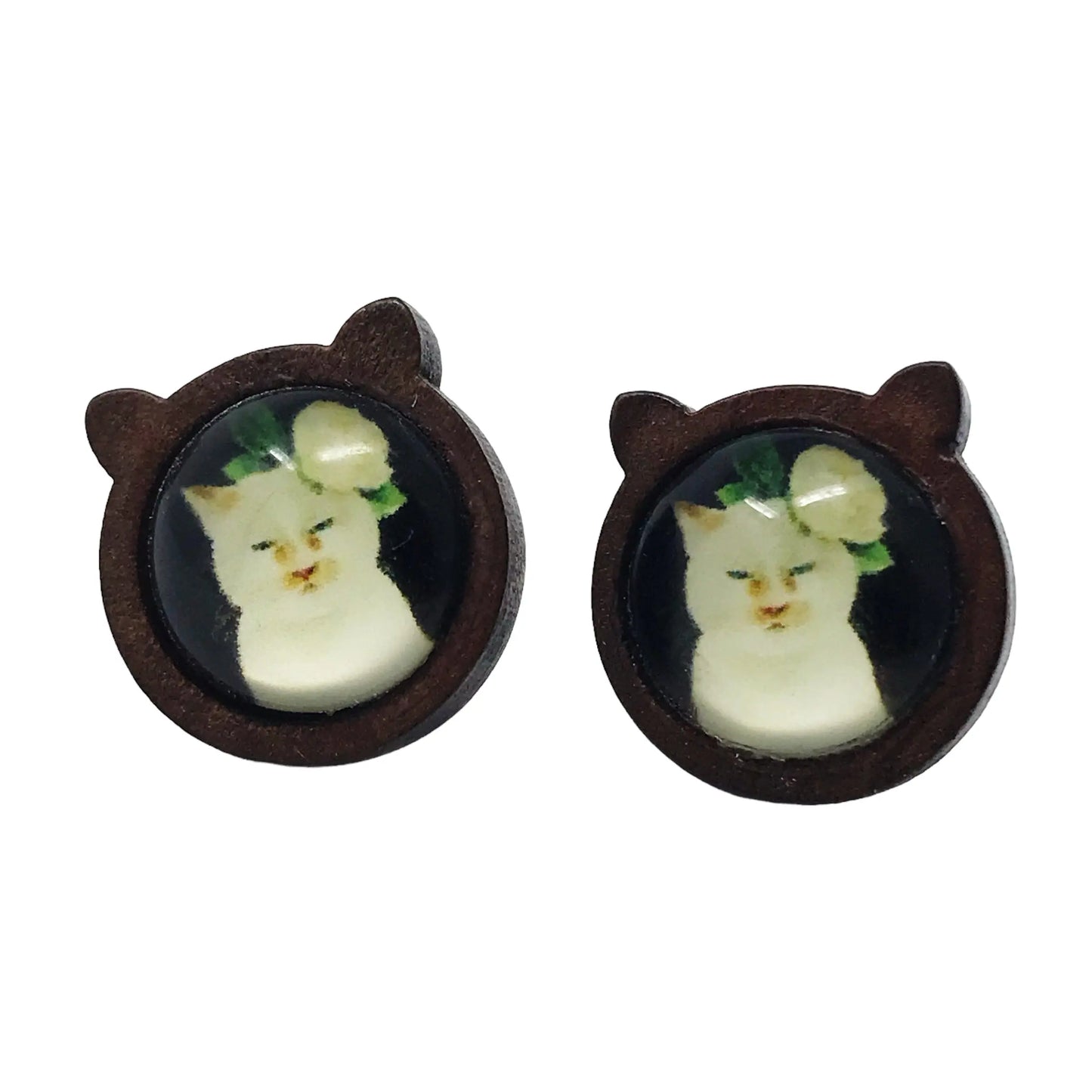 Cat shaped wood stud earrings with white cat artwork and floral detail on a white background