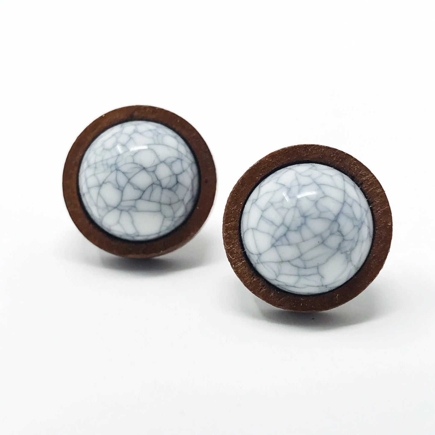Round white marble wood stud earrings displayed on a white background