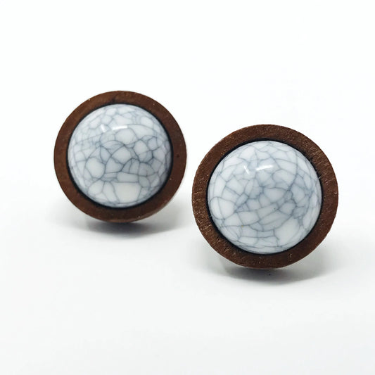 Round white marble wood stud earrings displayed on a white background