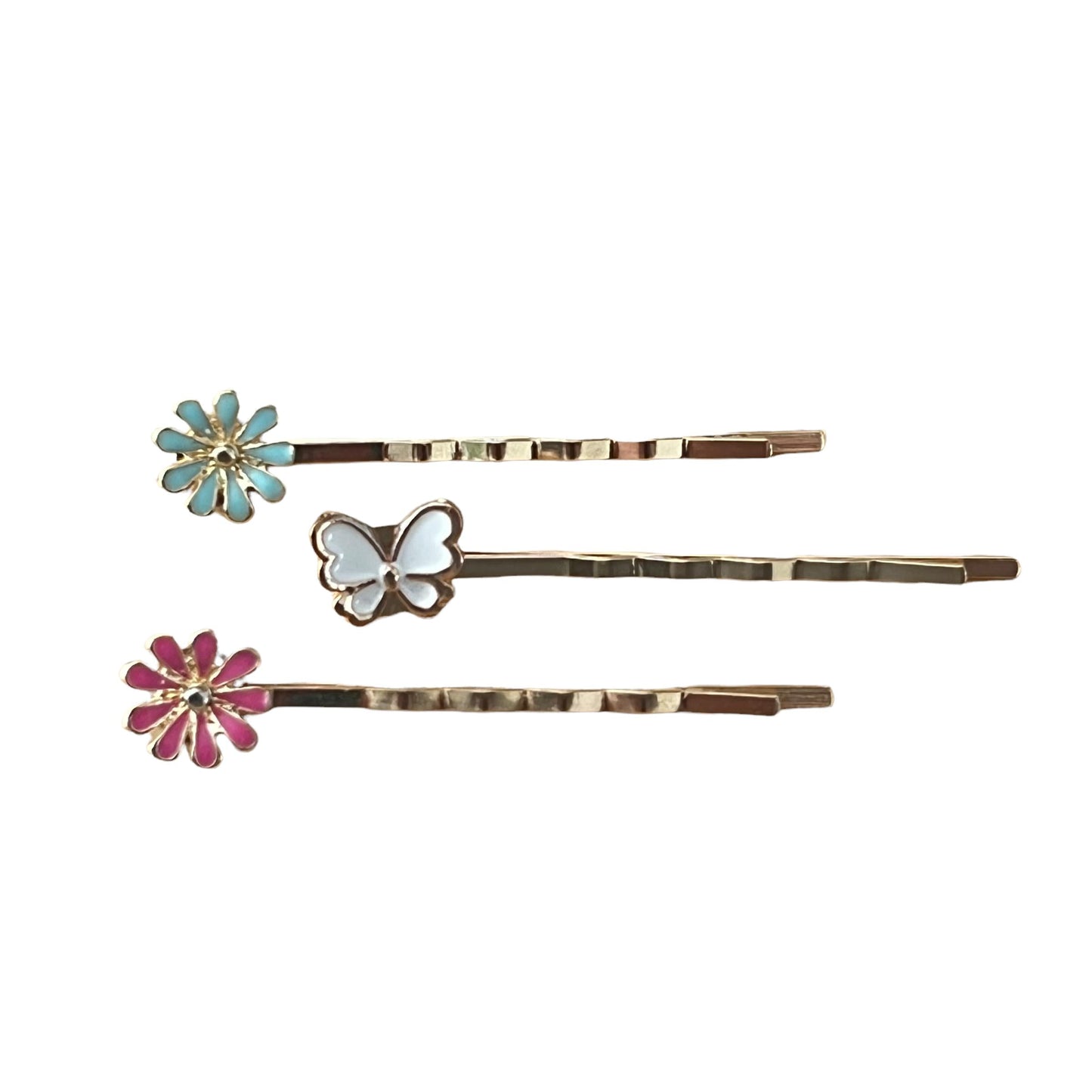 Close-up of white butterfly and flower hair pins with detailed texture