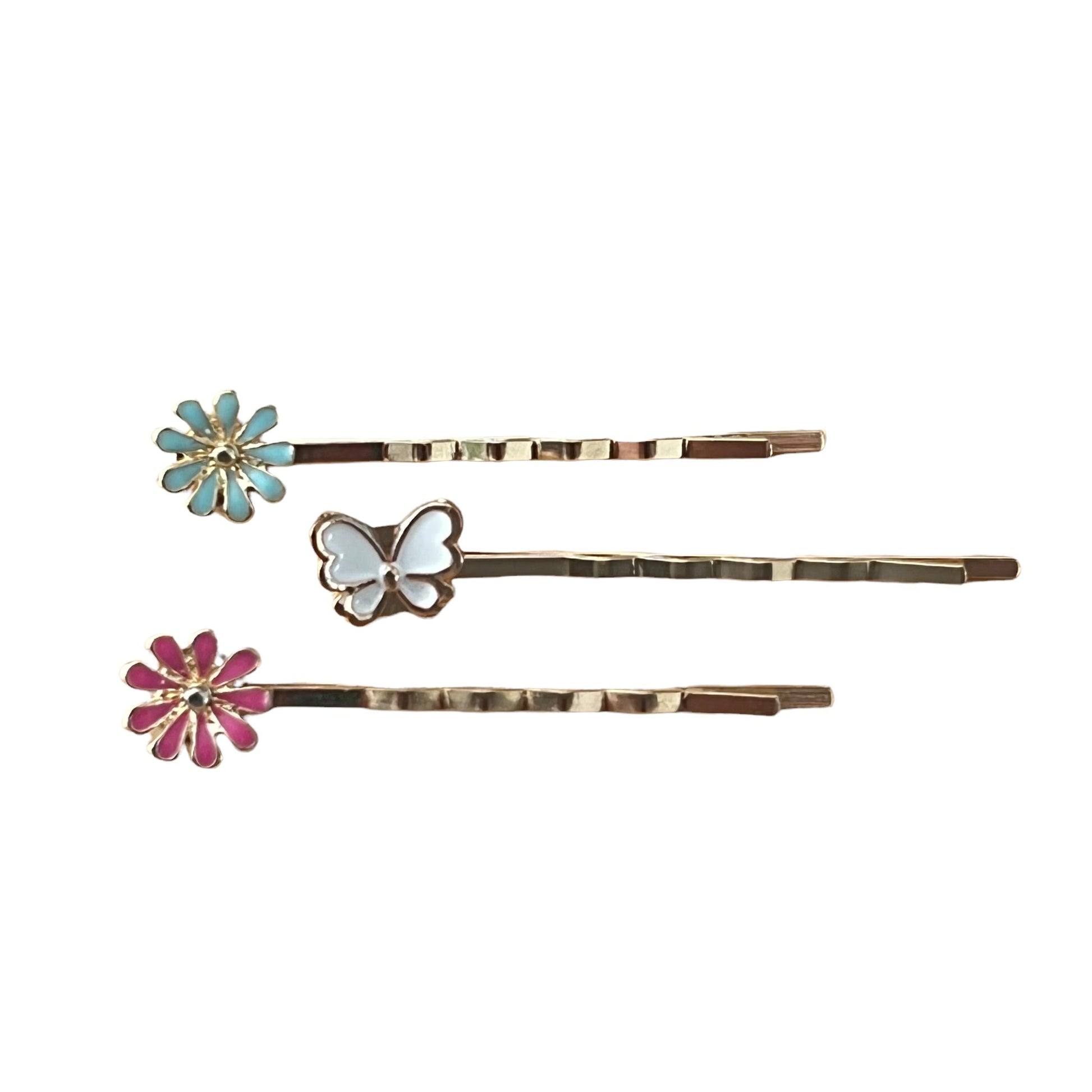Close-up of white butterfly and flower hair pins with detailed texture