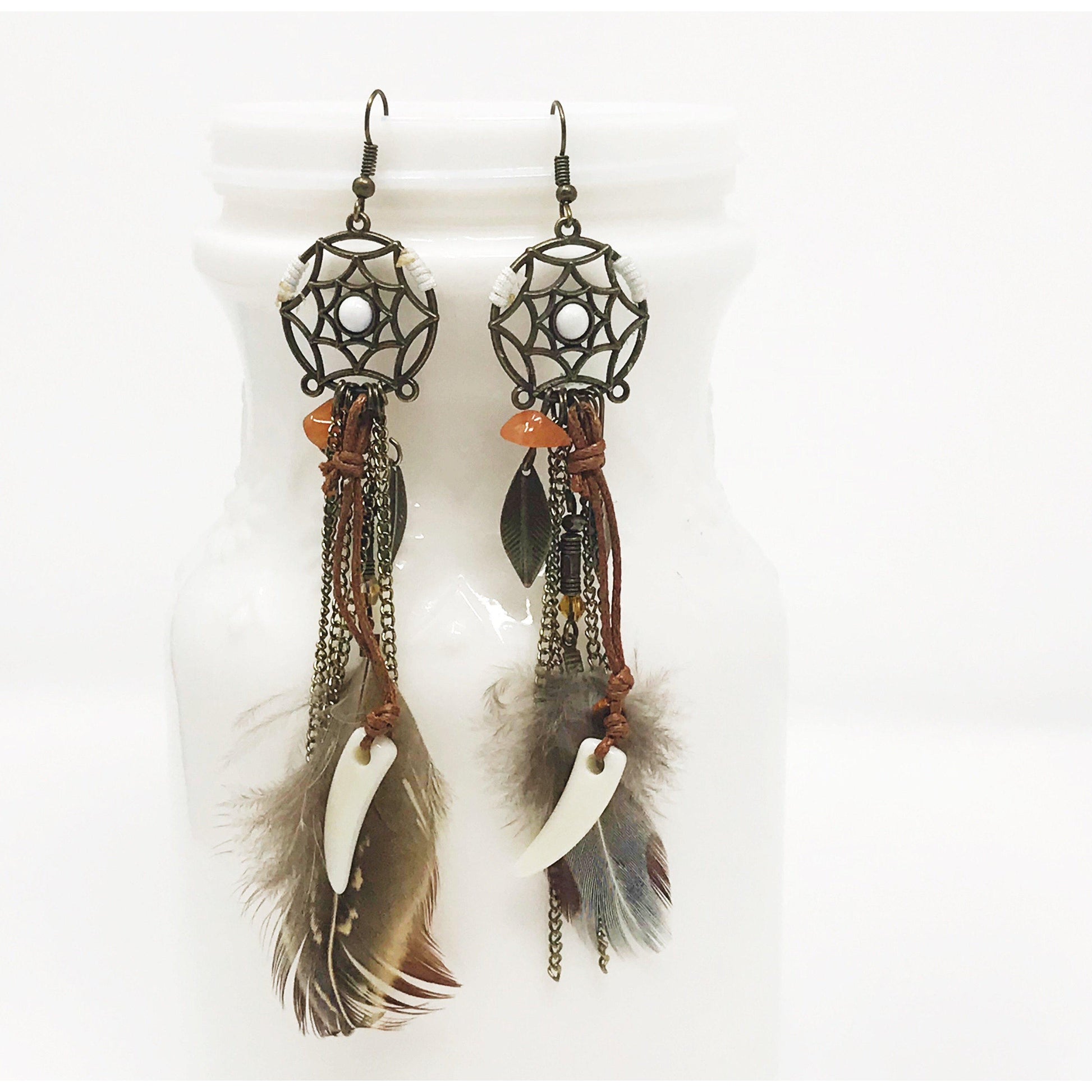 earrings photographed from side angle with soft natural lighting and earthy backdrop