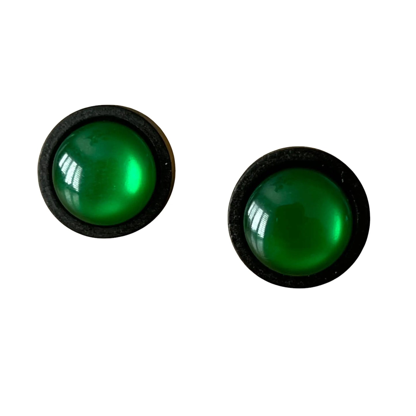 Pair of green round earrings with black frames on a white background