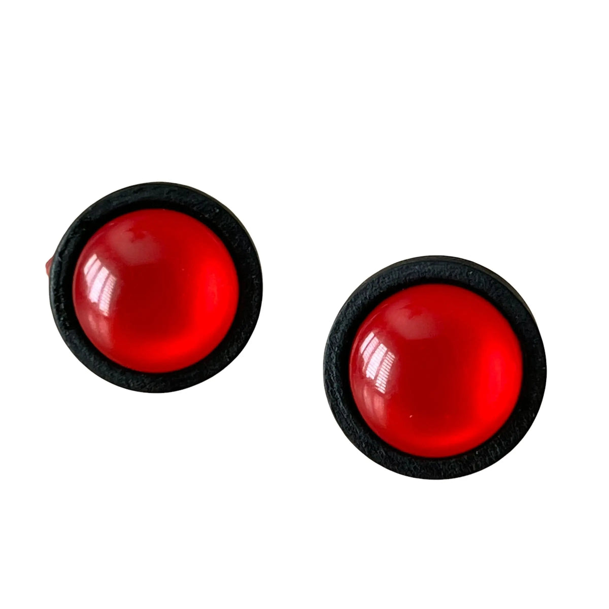 Round red resin stud earrings with black wood border displayed on a white background 