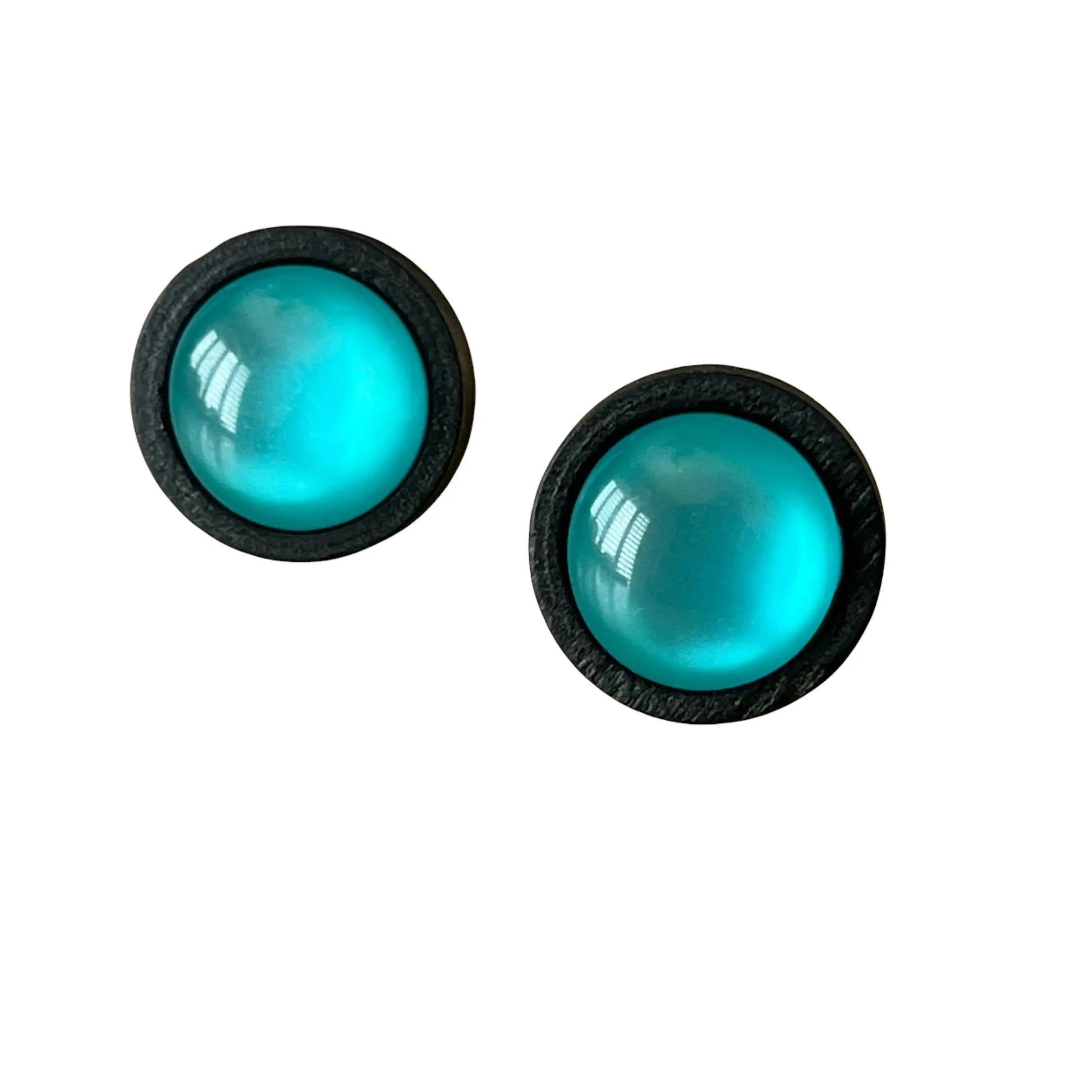 Round black wood stud earrings with glossy teal resin centers shown on white background 