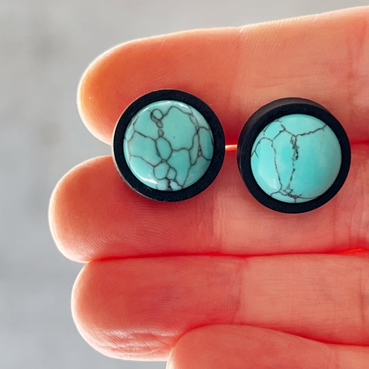 Turquoise Black Wood Stud Earrings -in hand for scale 