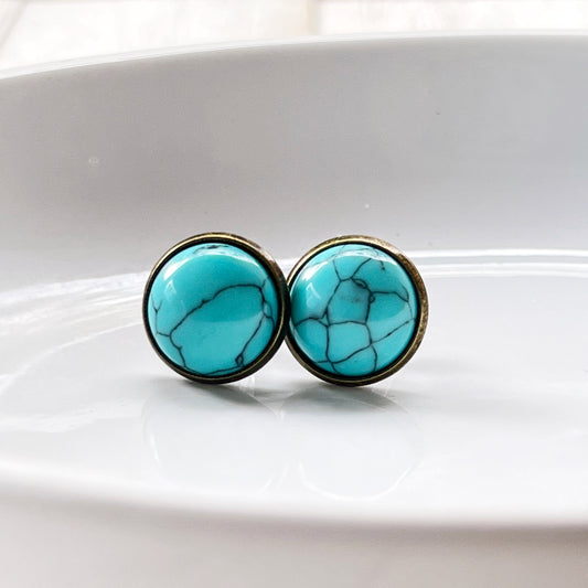 Turquoise 12mm Brass Stud Earrings in a white glass display 