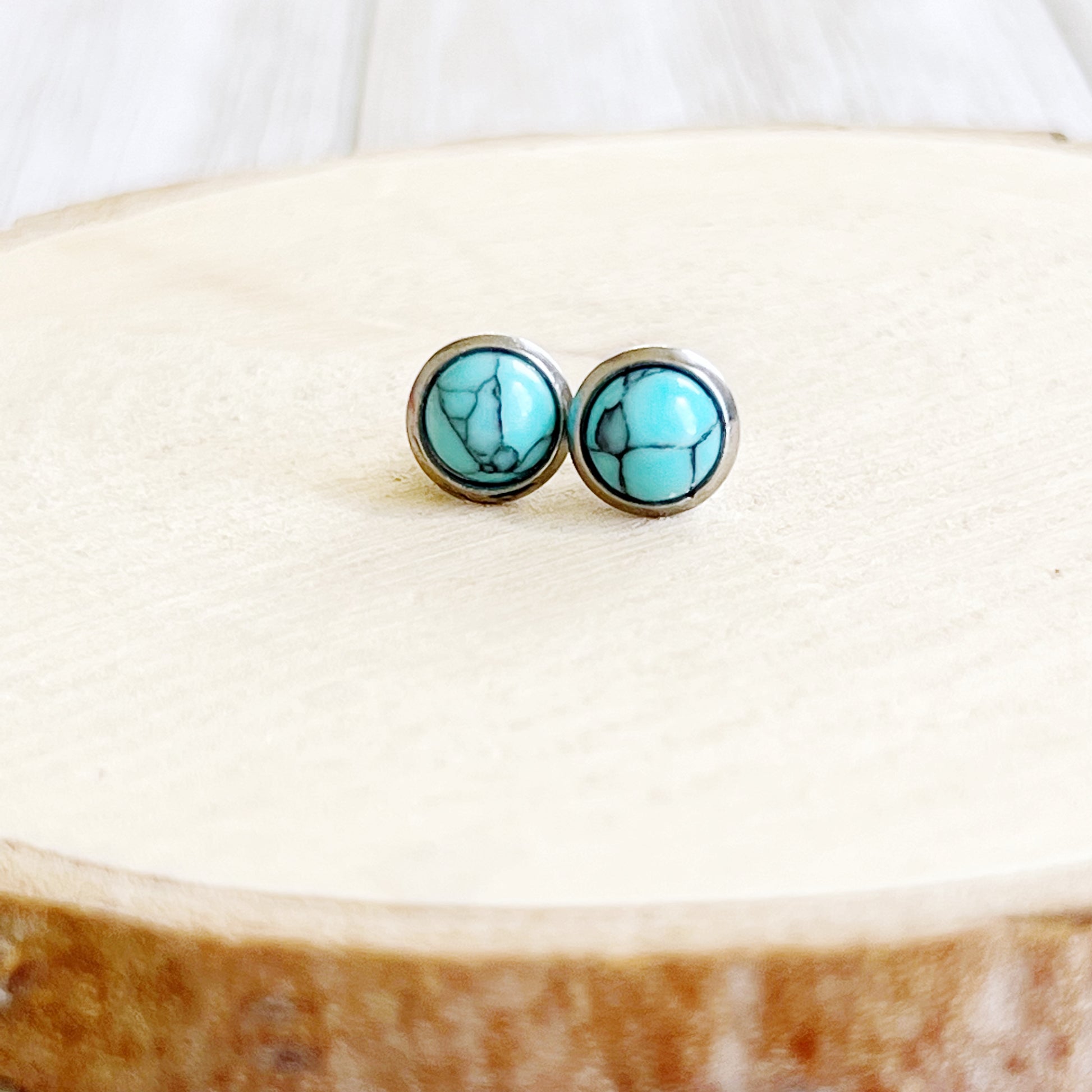 Turquoise Stud Earrings – 6mm Round Silver Boho Western Jewelry on wood slice